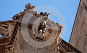 Stone gargoyle detail at Sant Miquel church