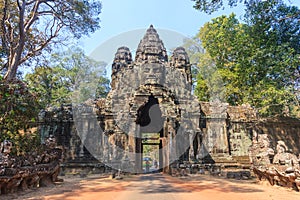 Stone Gate of Angkor Thom in Cambodia. Angkor Wat is the largest religious monument in the world.