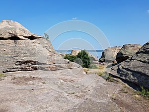 Stone granite rock in the steppe