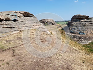 Stone granite rock in the steppe
