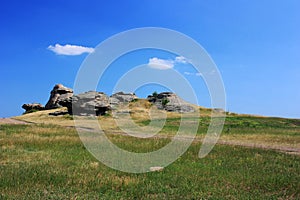 Stone granite rocks in the steppe