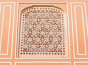 Stone grating on the wall in Mughal style - exterior detail of Jaipur City Palace, a palace complex in Rajasthan, India