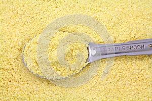 Stone ground yellow corn meal with tablespoon