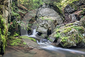 Stone guardian of the waterfalls - bizarre boulder on the bank