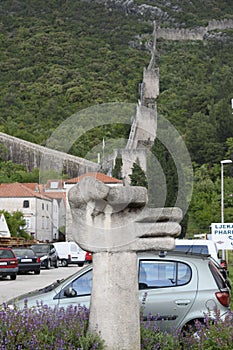 Stone hand in front of the wall, in Ston, Dubrovnik Neretva county, located on the Peljesac peninsula, Croatia photo