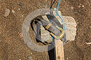 Stone handmade indigenous hammer made with rock and belt