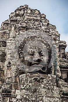 Stone head on towers of Bayon temple in Angkor Thom, Cambodia. S