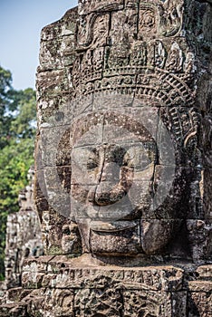 Stone head on towers of Bayon temple in Angkor Thom, Cambodia. S