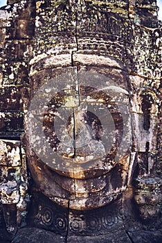 Stone head on towers of Bayon temple in Angkor Thom, Siem Reap,