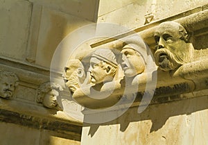 Stone heads of townspeople - Sibenik cathedral photo
