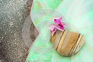 Stone heart with orchid flower