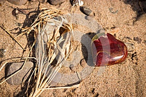 Stone Heart in the Sand on the Beach