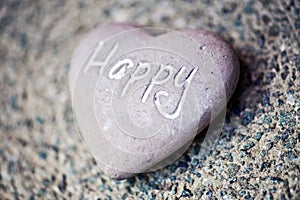 Stone heart with the word - Happy