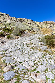 Stone hiking trail to the Laguna Grande de Gredos lake, Sierra de Gredos, Spain. photo