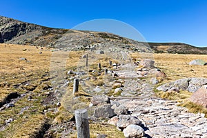 Stone hiking trail to the Laguna Grande de Gredos, Sierra de Gredos mountains, Spain photo