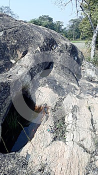 On the stone of holl and in the permanent water every time in the jharkhand . photo