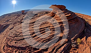 Stone hoodoo with wavy sandstone at Ferry Swale near Page AZ