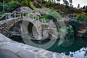 Stone house and bridge, village Foz de Egua, Portugal photo