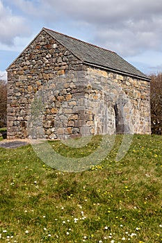 Stone house with Celtic cross photo