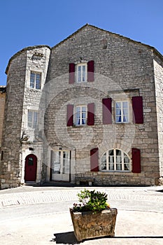 Stone house in the central square of the village of La Cavalerie, former commandery of the Templars