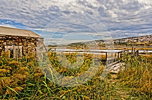 Stone house in between reed. HDR picture