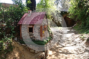 Stone house of the three little pigs in a street in the town of Jabugo, Huelva, Spain