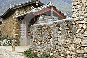 Stone house and wall in Naxi village, China