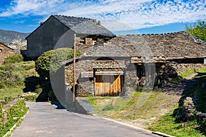 Stone houses with brick roofs on the north mountain of Guadalajara, Majaelrayo. photo