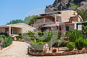 Stone houses with green garden