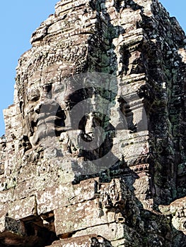 Stone human faces featured on the towers of Khmer Bayon Temple