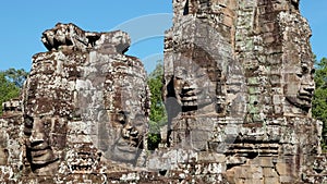 Stone human faces on the towers of the Bayon Temple, an architectural spectacle of the Khmer era in Cambodia