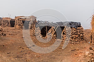 Stone huts at Erta Ale volcano crater rim in Afar depression, Ethiop