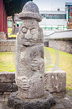 Stone idol (Dolharubang, the grandfather stones) at front of J