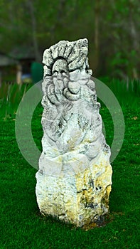 Stone idol in the forest