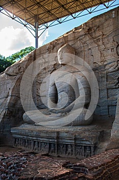 Stone image of Buddha Gautama in dhyana mudra photo