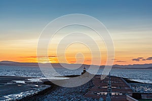 The Stone Jetty and Lighthouse in Morecambe at dawn.