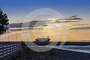 The Stone Jetty and Lighthouse in Morecambe at dawn.