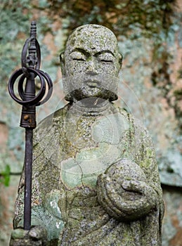 Stone Jizo statue in the mountains