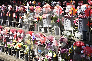 Stone Jizo statues, patrons of unborn children, at Zozo-ji Temple in Japan