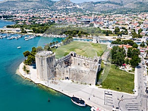 Stone Kamerlengo Castle, medieval city walls and yachts marina. Aerial view of touristic old Trogir, historic town.