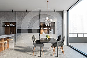 Stone kitchen interior with bar, table and balcony