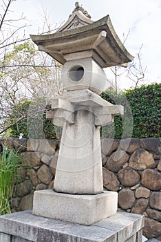 Stone lamp in Hokoku Shrine at Osaka Castle Park in Osaka, Japan