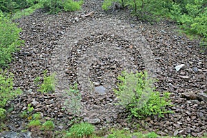 Stone landslide under spring rain, horizontal orientation