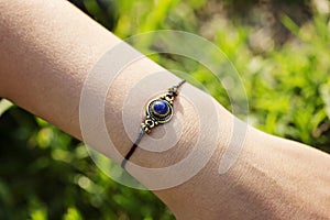 stone lapis lazuli pendant bead bracelet on female wrist