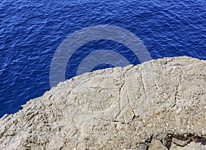 Stone ledge above the sea.