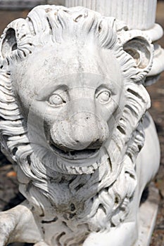 Stone lion face close up. Angry lion sculpture.