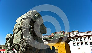 The stone lion in front of the Potala Palace