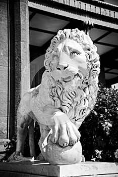 Stone lion in the park of the Vorontsov Palace built in the 19th century near the Crimean mountains