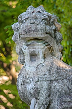 Stone Lion Statue in Natural Setting