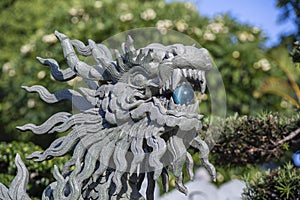 Stone lion statue in outdoors park, Vietnam. Close up